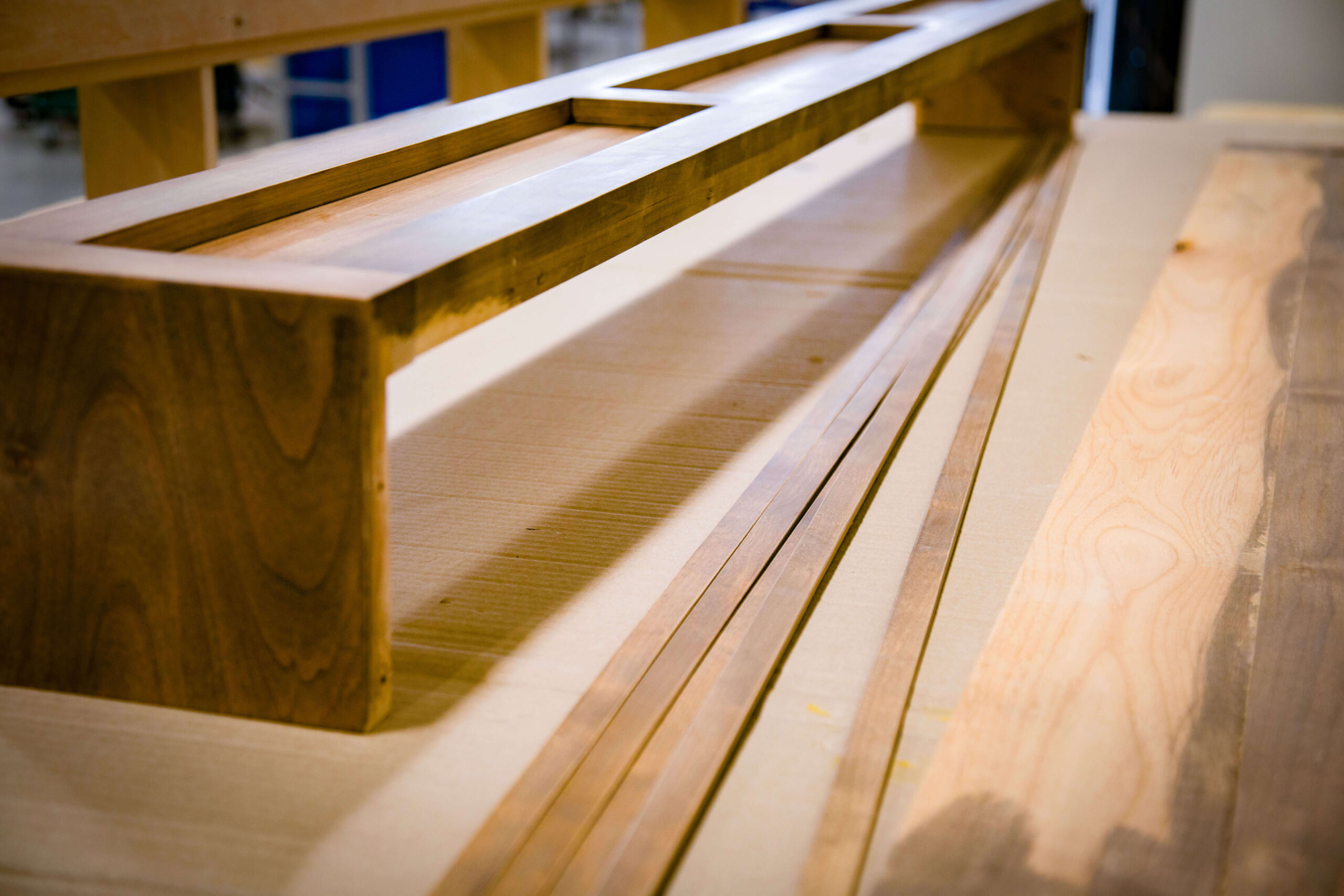Assembled walnut cabinet frame on the bench