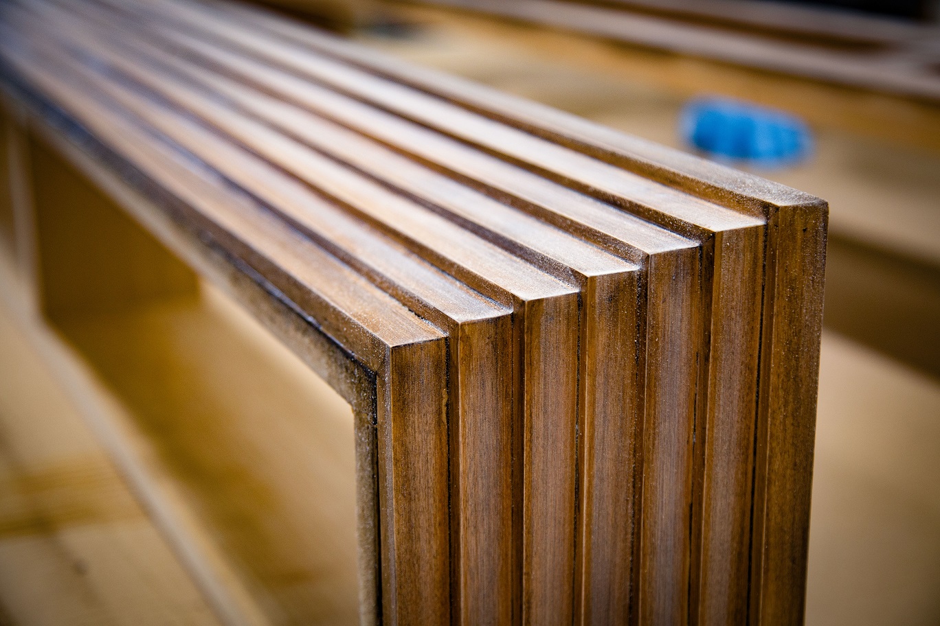 Close-up of solid wood cabinet frames on the bench
