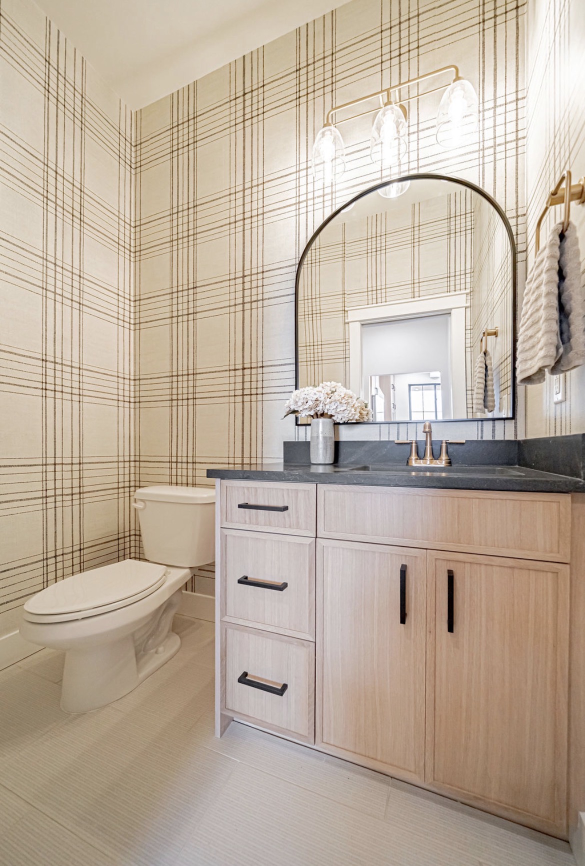 Powder room vanity with plaid wallcovering
