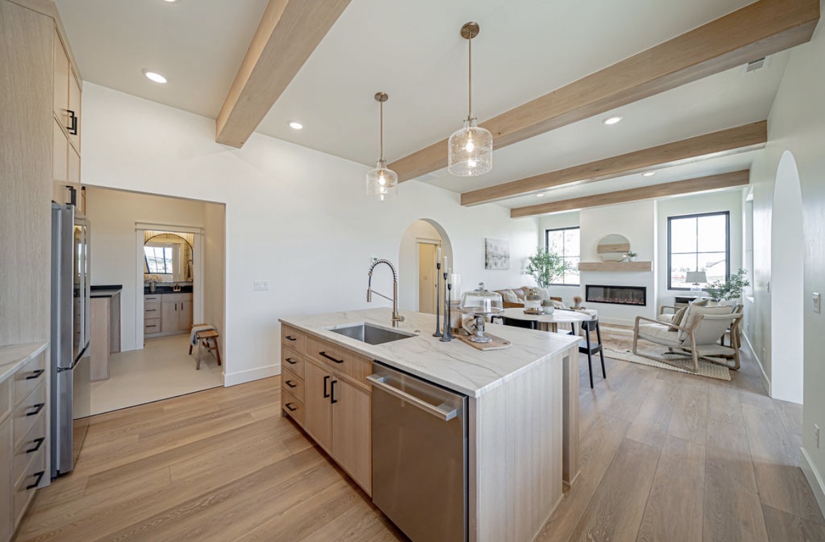 Kitchen island and perimeter cabinetry in light oak