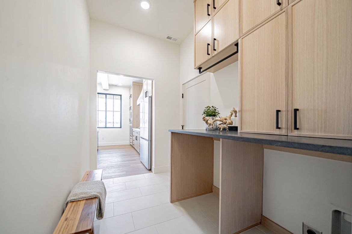 Custom mudroom built-ins with a desk and upper cabinets