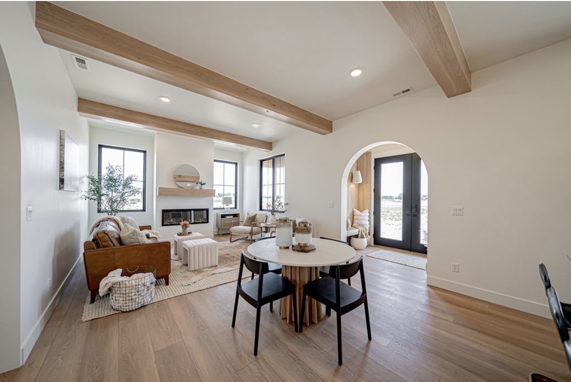 Dining area beside the kitchen under beamed ceilings