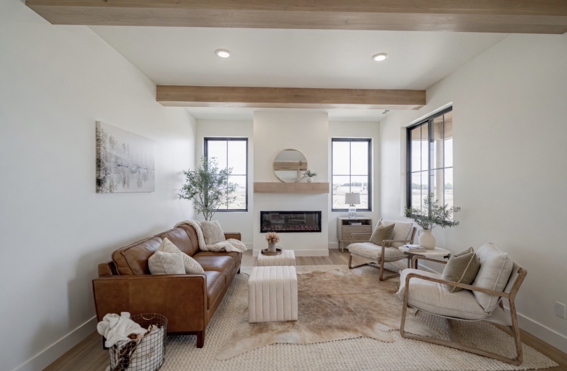 Living room with fireplace and beamed ceiling